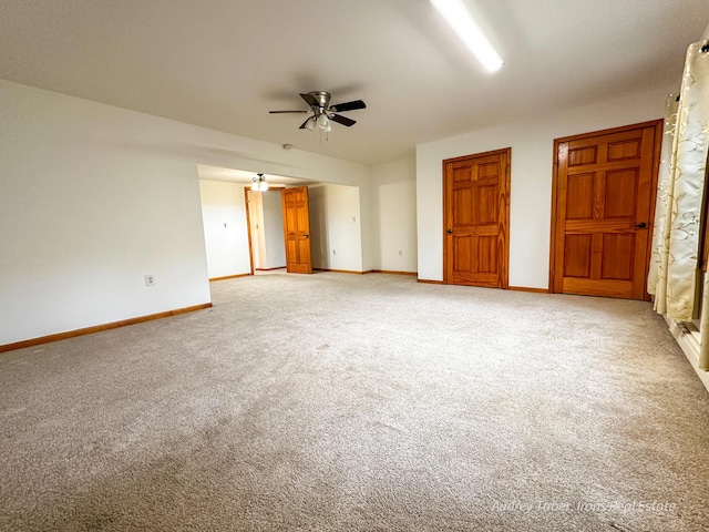 4307 N Mac Rd, Irons, MI 49644 - unfurnished bedroom with light carpet and baseboards