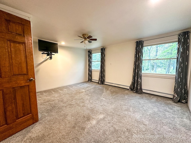4307 N Mac Rd, Irons, MI 49644 - empty room with carpet floors, a baseboard heating unit, ceiling fan, and recessed lighting