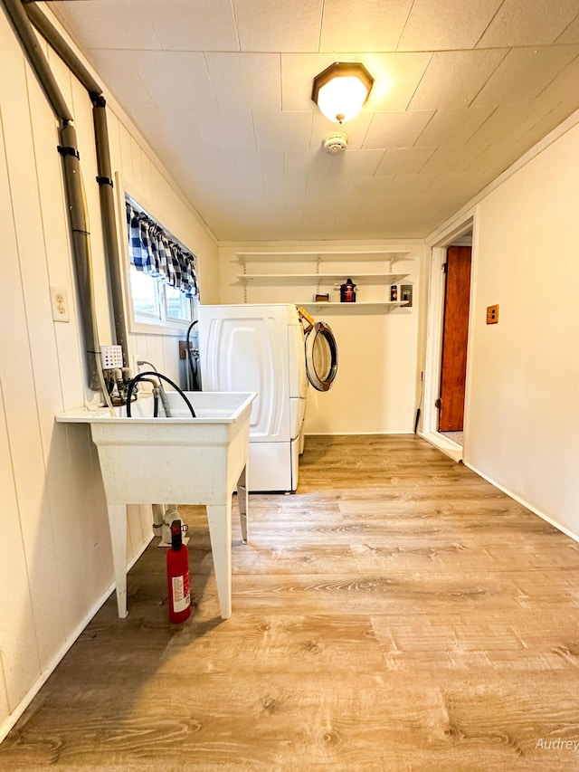 4307 N Mac Rd, Irons, MI 49644 - washroom with wood finished floors and washer / dryer