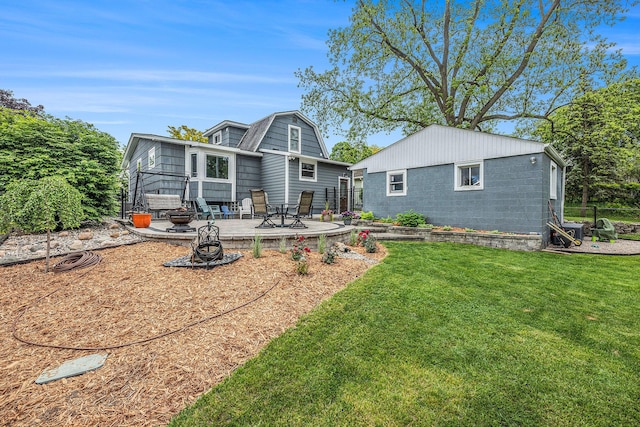 403 N Helen Ave, Rochester, MI 48307 - back of property with a yard, an outdoor fire pit, concrete block siding, and a gambrel roof