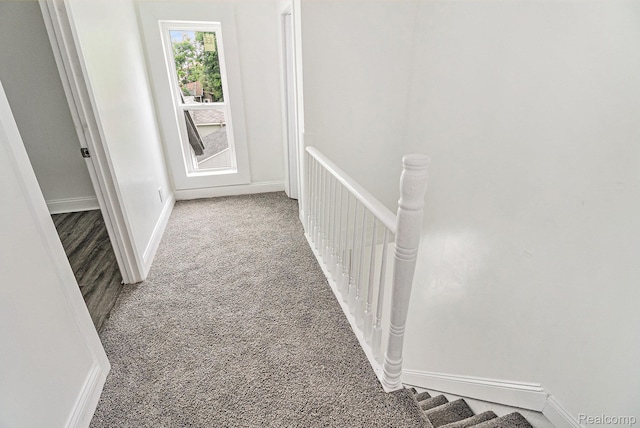 204 E Clinton St, Durand, MI 48429 - hallway with carpet and an upstairs landing