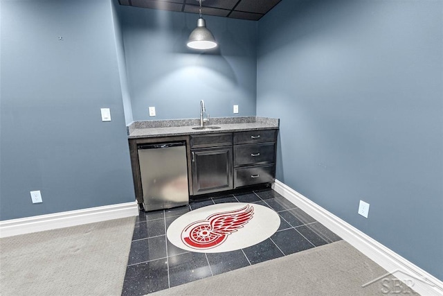 10399 Webster Rd, Freeland, MI 48623 - indoor wet bar featuring dishwasher, baseboards, and decorative light fixtures