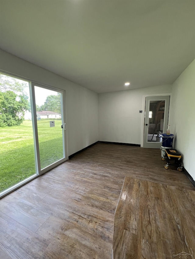1765 Ribble St, Saginaw, MI 48601 - unfurnished living room with wood finished floors and recessed lighting