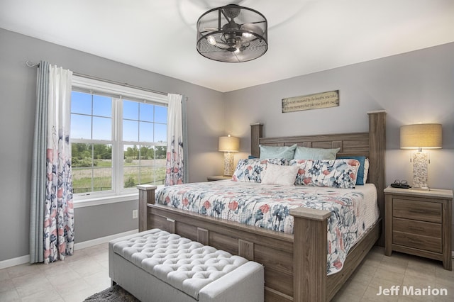 2057 Nickleplate Rd, Ionia, MI 48846 - bedroom with baseboards and light tile patterned floors