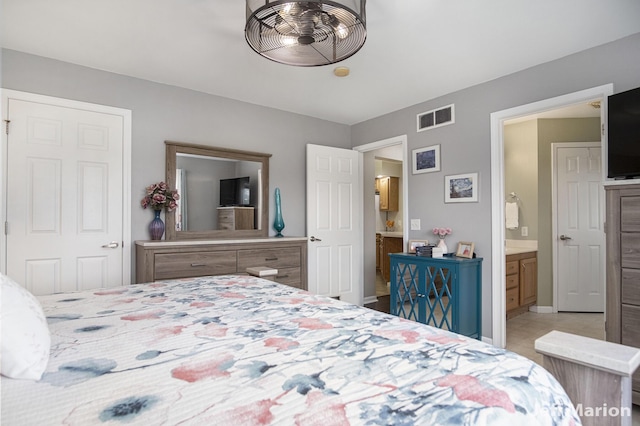 2057 Nickleplate Rd, Ionia, MI 48846 - bedroom featuring connected bathroom and baseboards