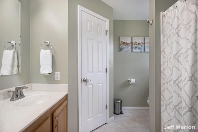 2057 Nickleplate Rd, Ionia, MI 48846 - full bathroom featuring vanity, toilet, and tile patterned floors