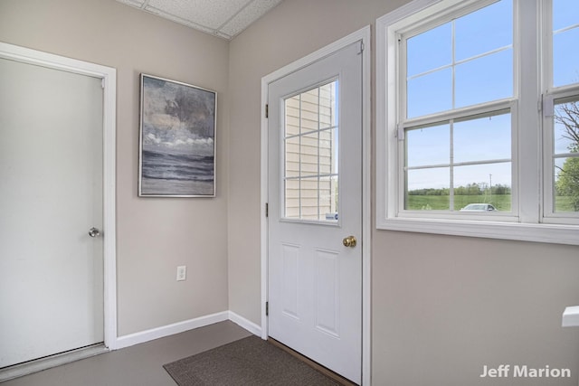 2057 Nickleplate Rd, Ionia, MI 48846 - entryway featuring baseboards and a paneled ceiling