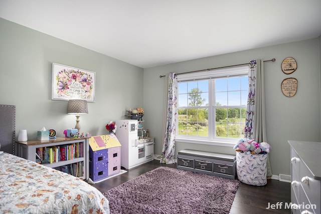 2057 Nickleplate Rd, Ionia, MI 48846 - bedroom with dark wood-style floors and baseboards