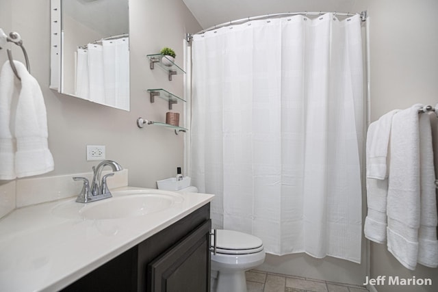 2057 Nickleplate Rd, Ionia, MI 48846 - bathroom with toilet, vanity, and tile patterned flooring