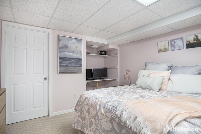 2057 Nickleplate Rd, Ionia, MI 48846 - bedroom featuring a paneled ceiling, carpet, and baseboards