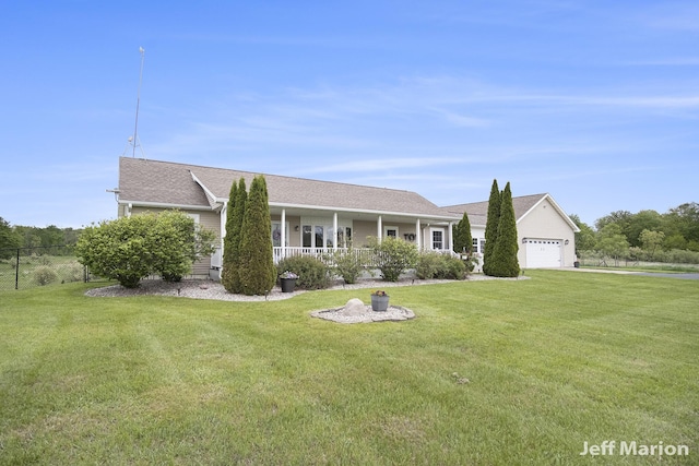 2057 Nickleplate Rd, Ionia, MI 48846 - single story home with a garage, a porch, driveway, and a shingled roof