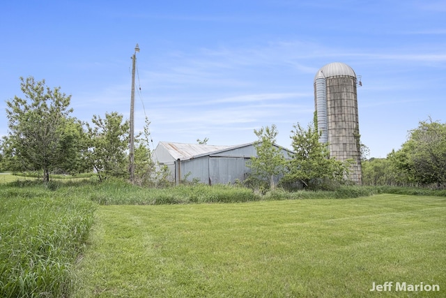 2057 Nickleplate Rd, Ionia, MI 48846 - view of green lawn featuring a pole building and an outdoor structure