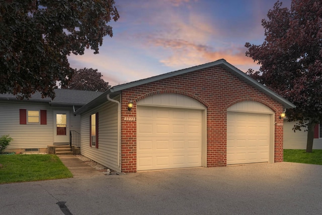 3272 Cambridge St SE, Grand Rapids, MI 49512 - single story home with asphalt driveway, a garage, brick siding, and entry steps