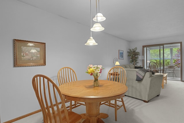 3272 Cambridge St SE, Grand Rapids, MI 49512 - dining room featuring light colored carpet and baseboards