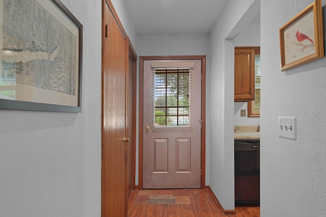 3272 Cambridge St SE, Grand Rapids, MI 49512 - doorway to outside with wood finished floors