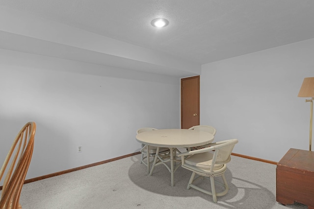 3272 Cambridge St SE, Grand Rapids, MI 49512 - dining area featuring baseboards and carpet floors