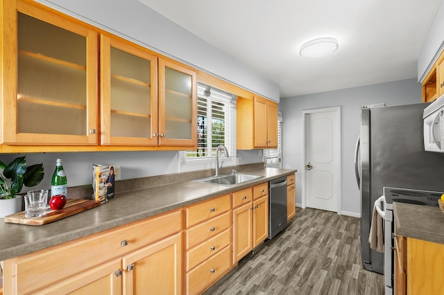 313 W Kilgore Rd, Portage, MI 49002 - kitchen featuring a sink, electric range, dishwasher, wood finished floors, and glass insert cabinets