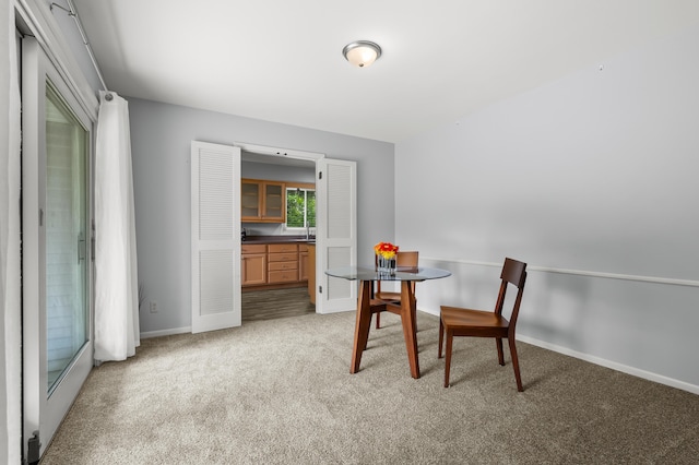 313 W Kilgore Rd, Portage, MI 49002 - dining room featuring light carpet and baseboards