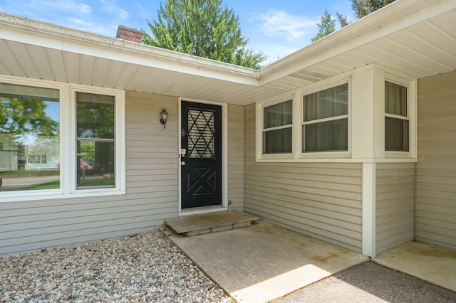313 W Kilgore Rd, Portage, MI 49002 - view of exterior entry with a chimney
