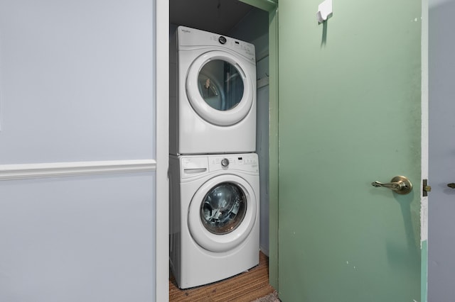 313 W Kilgore Rd, Portage, MI 49002 - washroom featuring estacked washer and dryer and wood finished floors