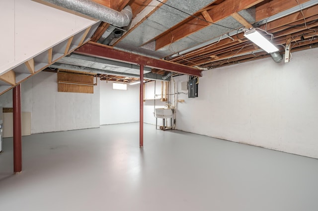313 W Kilgore Rd, Portage, MI 49002 - unfinished below grade area featuring a sink and electric panel