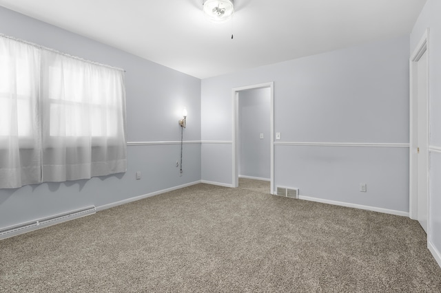 313 W Kilgore Rd, Portage, MI 49002 - empty room featuring carpet floors, baseboard heating, and baseboards