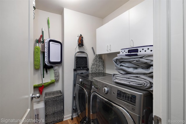 340 N Wixom Rd, Wixom, MI 48393 - laundry area featuring cabinet space, separate washer and dryer, light wood-type flooring, and baseboards