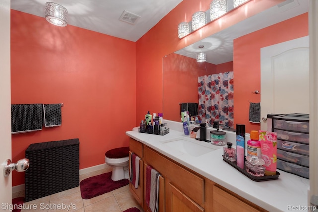 340 N Wixom Rd, Wixom, MI 48393 - full bathroom featuring toilet, vanity, tile patterned floors, and baseboards