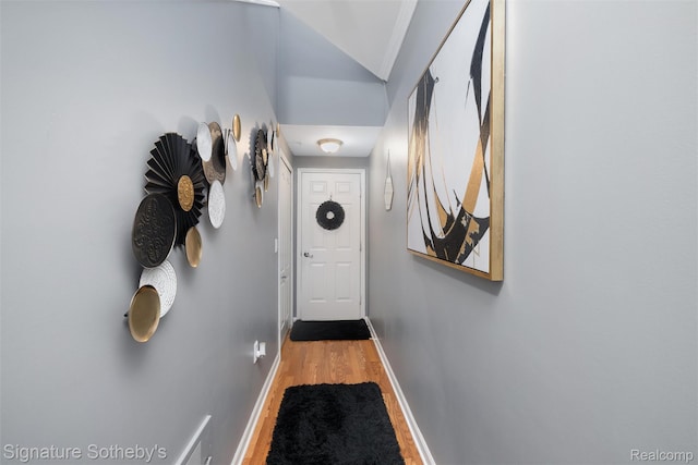 340 N Wixom Rd, Wixom, MI 48393 - doorway with wood finished floors, baseboards, and lofted ceiling