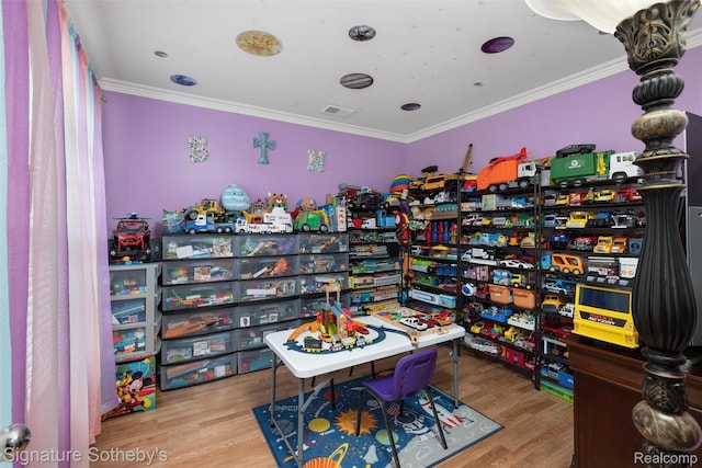 340 N Wixom Rd, Wixom, MI 48393 - misc room with ornamental molding and wood finished floors