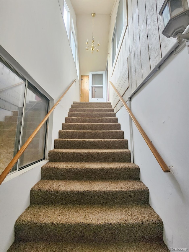 4390 Cass Elizabeth Rd, Waterford, MI 48328 - staircase with a chandelier and a towering ceiling