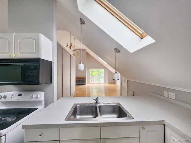4390 Cass Elizabeth Rd, Waterford, MI 48328 - kitchen with black microwave, white electric range, lofted ceiling, white cabinetry, and light countertops