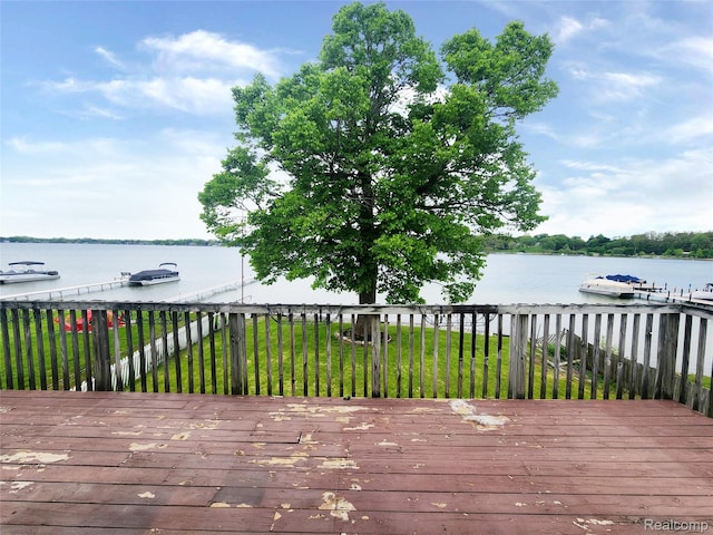 4390 Cass Elizabeth Rd, Waterford, MI 48328 - wooden deck featuring a water view and a lawn
