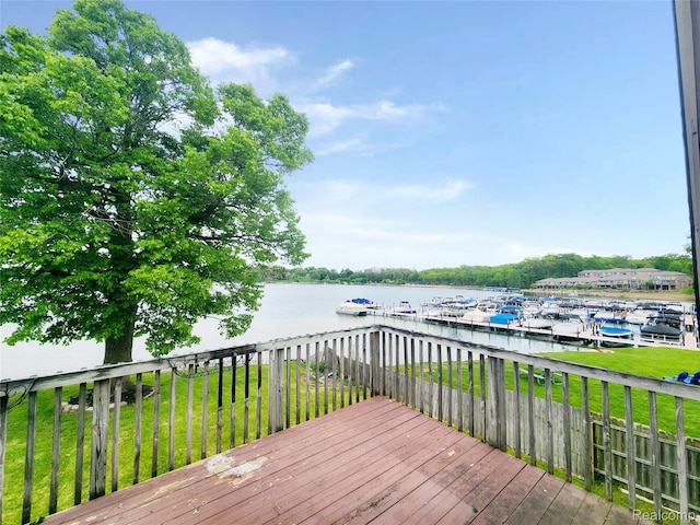 4390 Cass Elizabeth Rd, Waterford, MI 48328 - wooden terrace with a water view, a dock, and a lawn