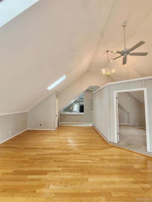4390 Cass Elizabeth Rd, Waterford, MI 48328 - additional living space with lofted ceiling, a ceiling fan, light wood finished floors, and a skylight