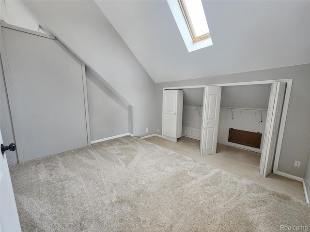 4390 Cass Elizabeth Rd, Waterford, MI 48328 - bonus room featuring a skylight, lofted ceiling, and light carpet