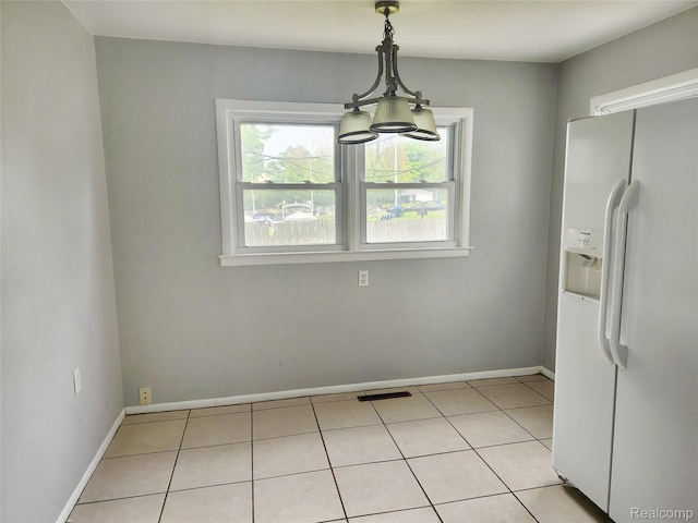4390 Cass Elizabeth Rd, Waterford, MI 48328 - unfurnished dining area with a chandelier and light tile patterned floors