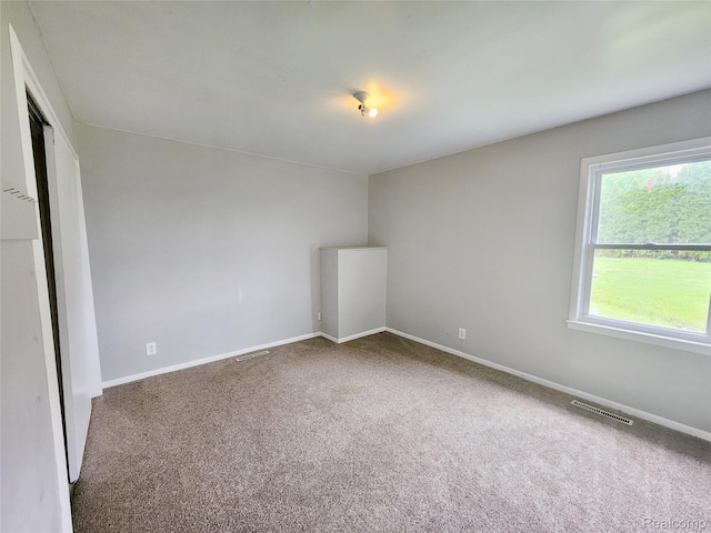 4390 Cass Elizabeth Rd, Waterford, MI 48328 - spare room with carpet and baseboards