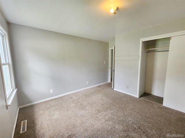 4390 Cass Elizabeth Rd, Waterford, MI 48328 - unfurnished bedroom featuring carpet flooring and a closet