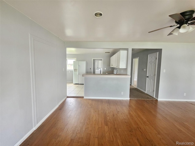 4390 Cass Elizabeth Rd, Waterford, MI 48328 - unfurnished living room featuring light wood-style floors and a ceiling fan