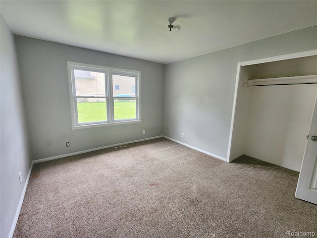 4390 Cass Elizabeth Rd, Waterford, MI 48328 - unfurnished bedroom featuring carpet floors and a closet
