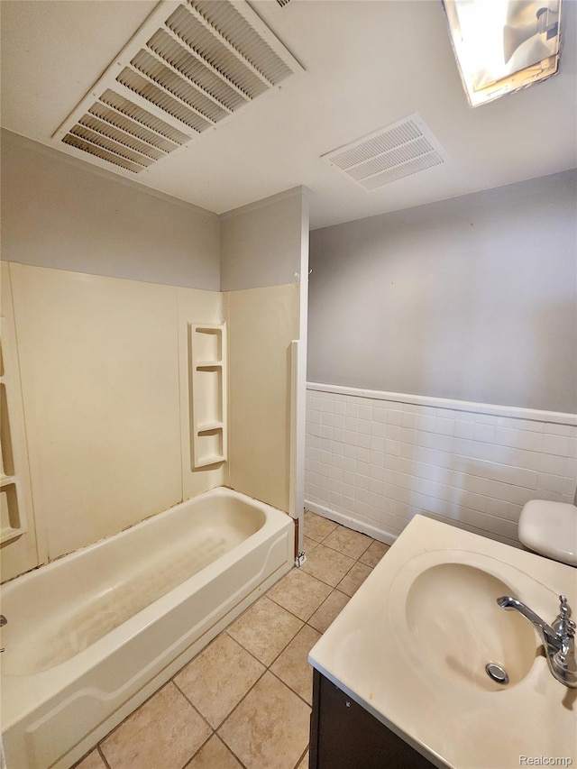 4390 Cass Elizabeth Rd, Waterford, MI 48328 - full bath featuring tile patterned flooring, vanity, washtub / shower combination, wainscoting, and tile walls