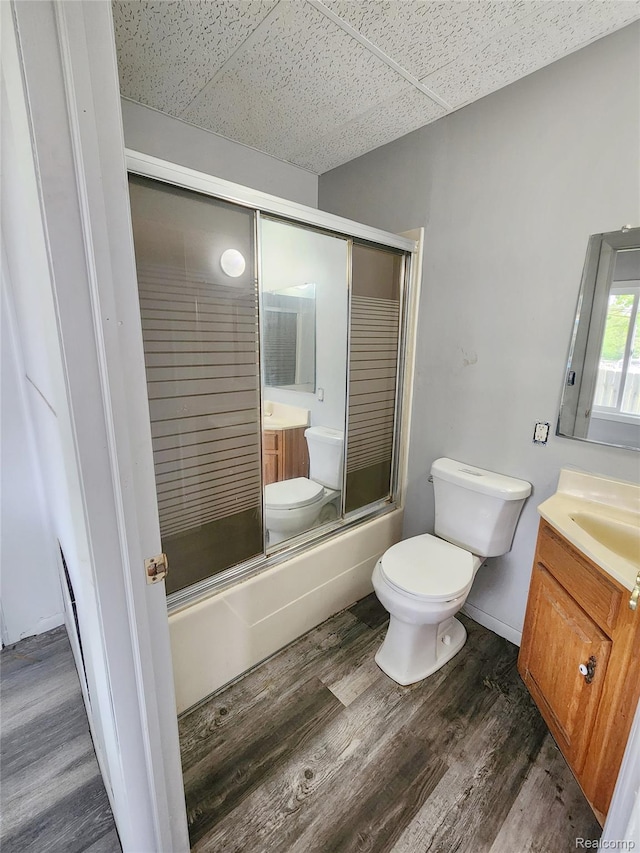 4390 Cass Elizabeth Rd, Waterford, MI 48328 - bathroom with vanity, shower / bath combination with glass door, wood finished floors, and a drop ceiling