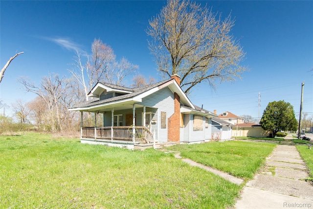 600 Alameda St, Highland Park, MI 48203 - view of front of home with covered porch and a front lawn