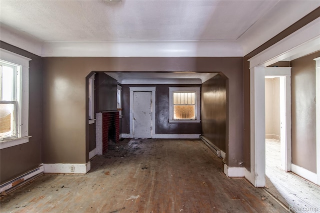 600 Alameda St, Highland Park, MI 48203 - hall with hardwood / wood-style flooring, baseboards, and a baseboard heating unit