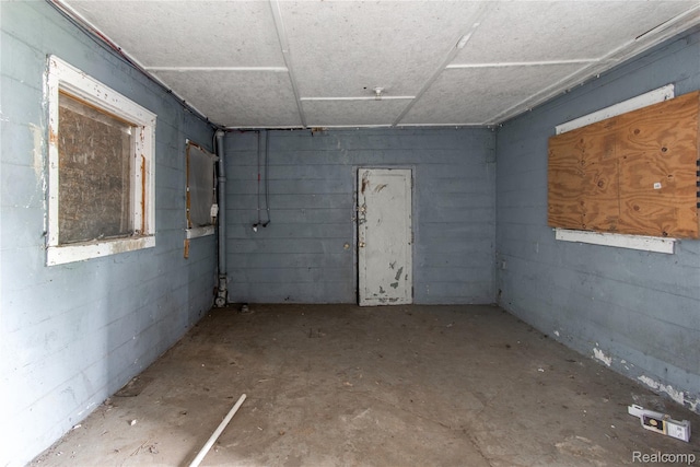 600 Alameda St, Highland Park, MI 48203 - unfurnished room with concrete block wall and unfinished concrete floors