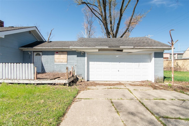 600 Alameda St, Highland Park, MI 48203 - view of front of property featuring concrete block siding and a shingled roof