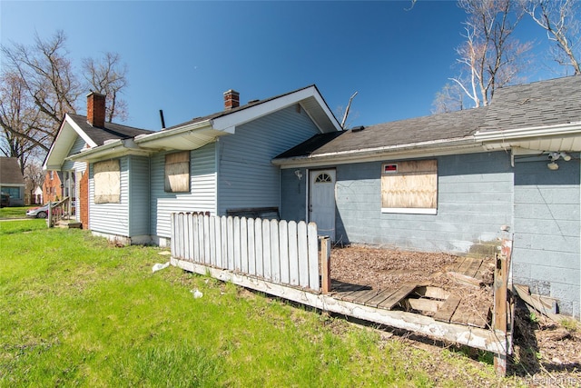 600 Alameda St, Highland Park, MI 48203 - view of home's exterior with a chimney and a shingled roof