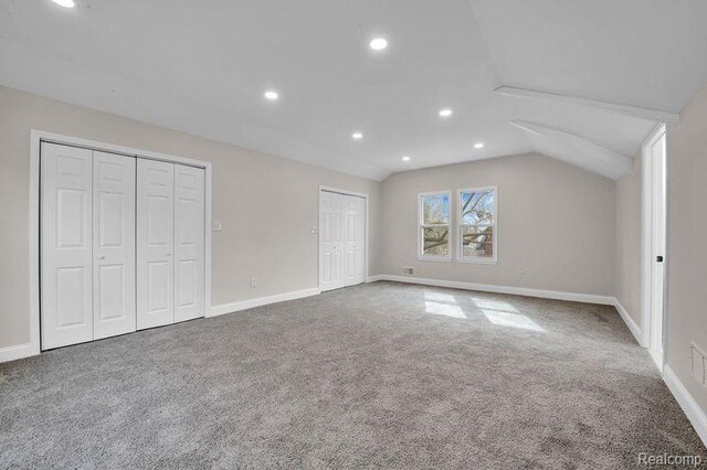13332 Maiden St, Detroit, MI 48213 - unfurnished bedroom with two closets, carpet floors, lofted ceiling, recessed lighting, and baseboards