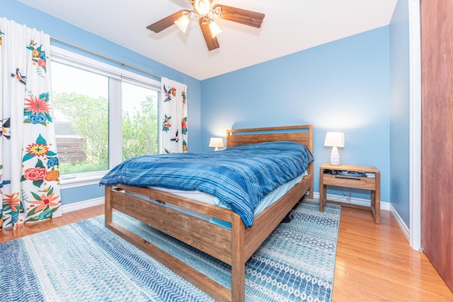 500 Little Lake Dr # 1, Ann Arbor, MI 48103 - bedroom featuring baseboards, light wood finished floors, and a ceiling fan